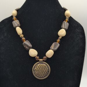 Vintage Elegant Brown and Cream Beaded Necklace With Gold Toned Medallion Focus
